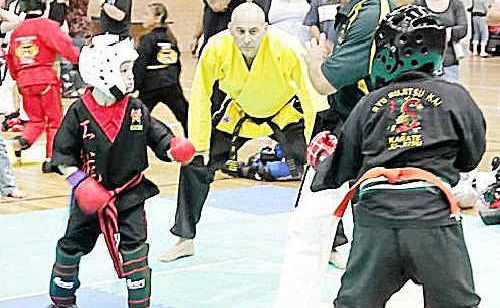 Lachlan Ivey (left) on the way to winning the seven years and under national title in kung fu. Lachlan Ivey (left) on the way to winning the seven years and under national title in kung fu.